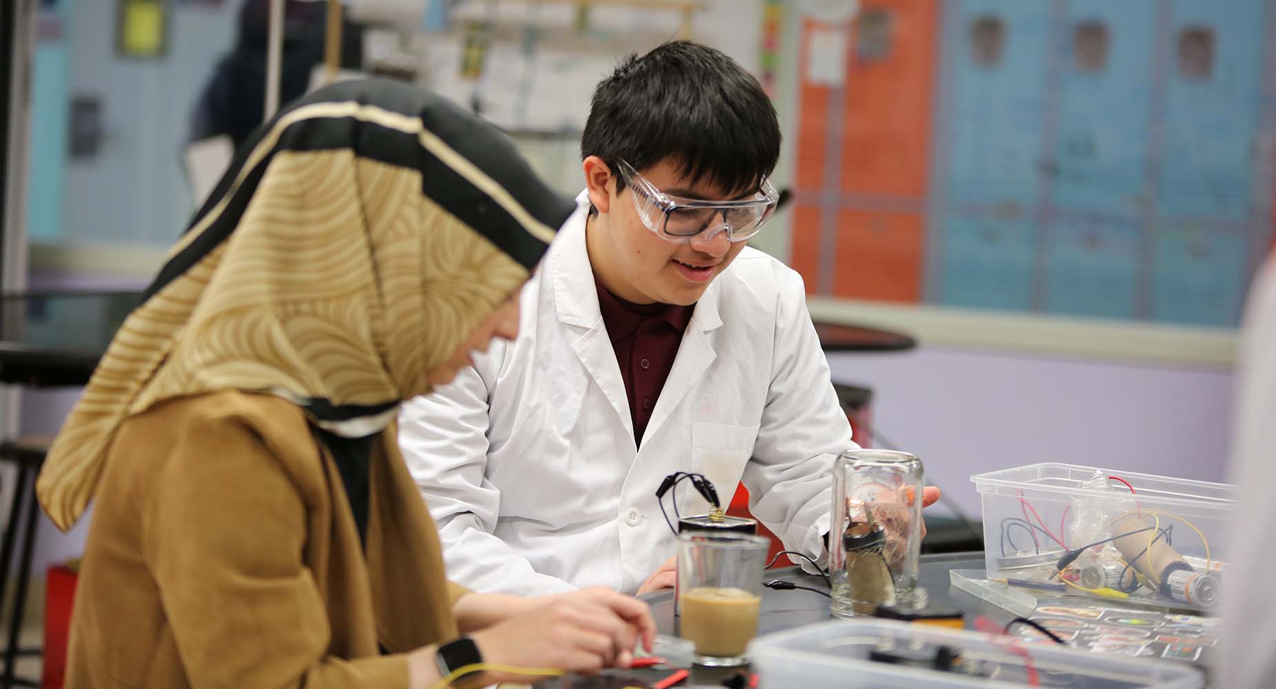 Teacher helping student