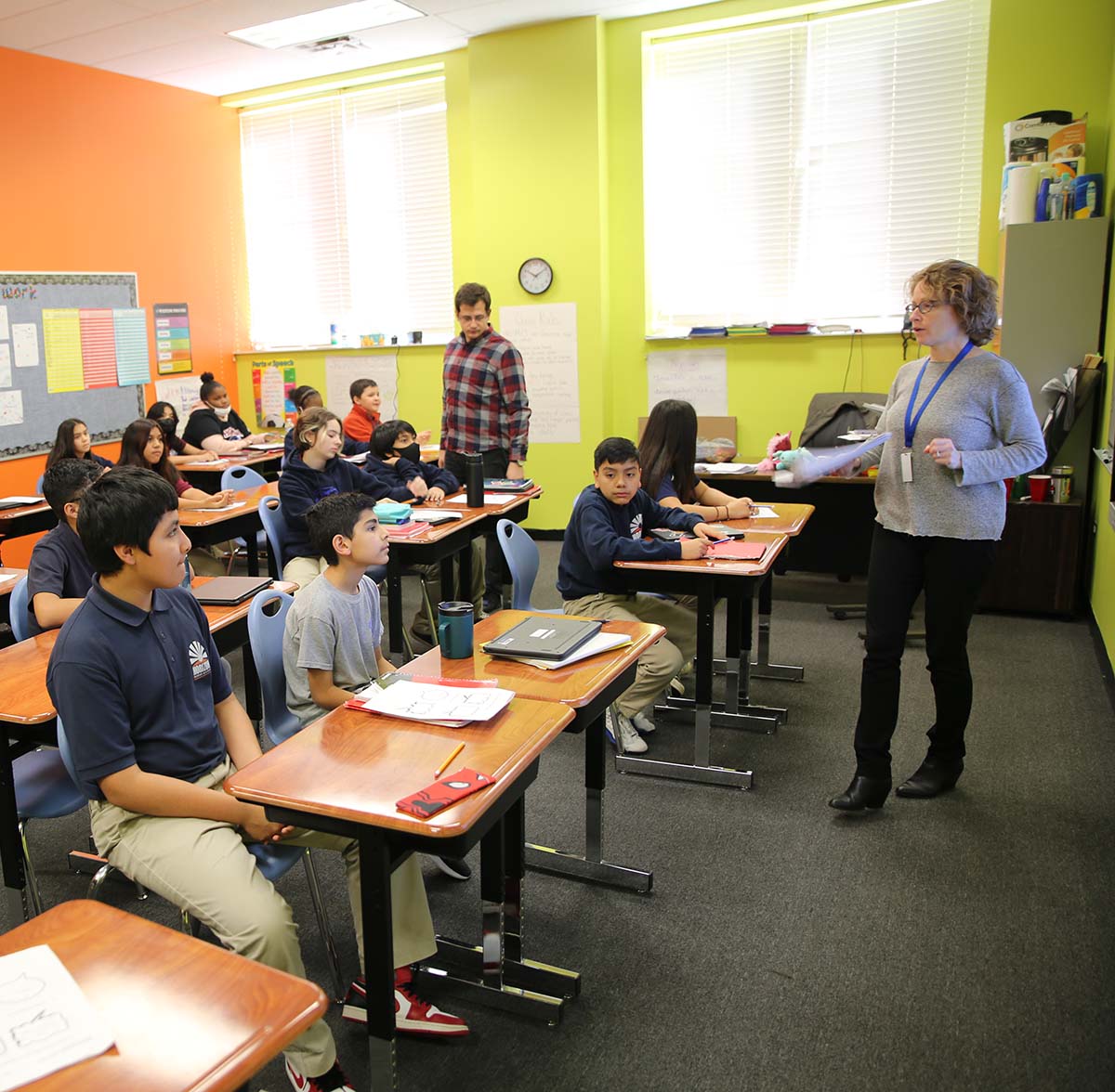 HSA McKinley Park High School Teacher and student interacting at a classroom desk