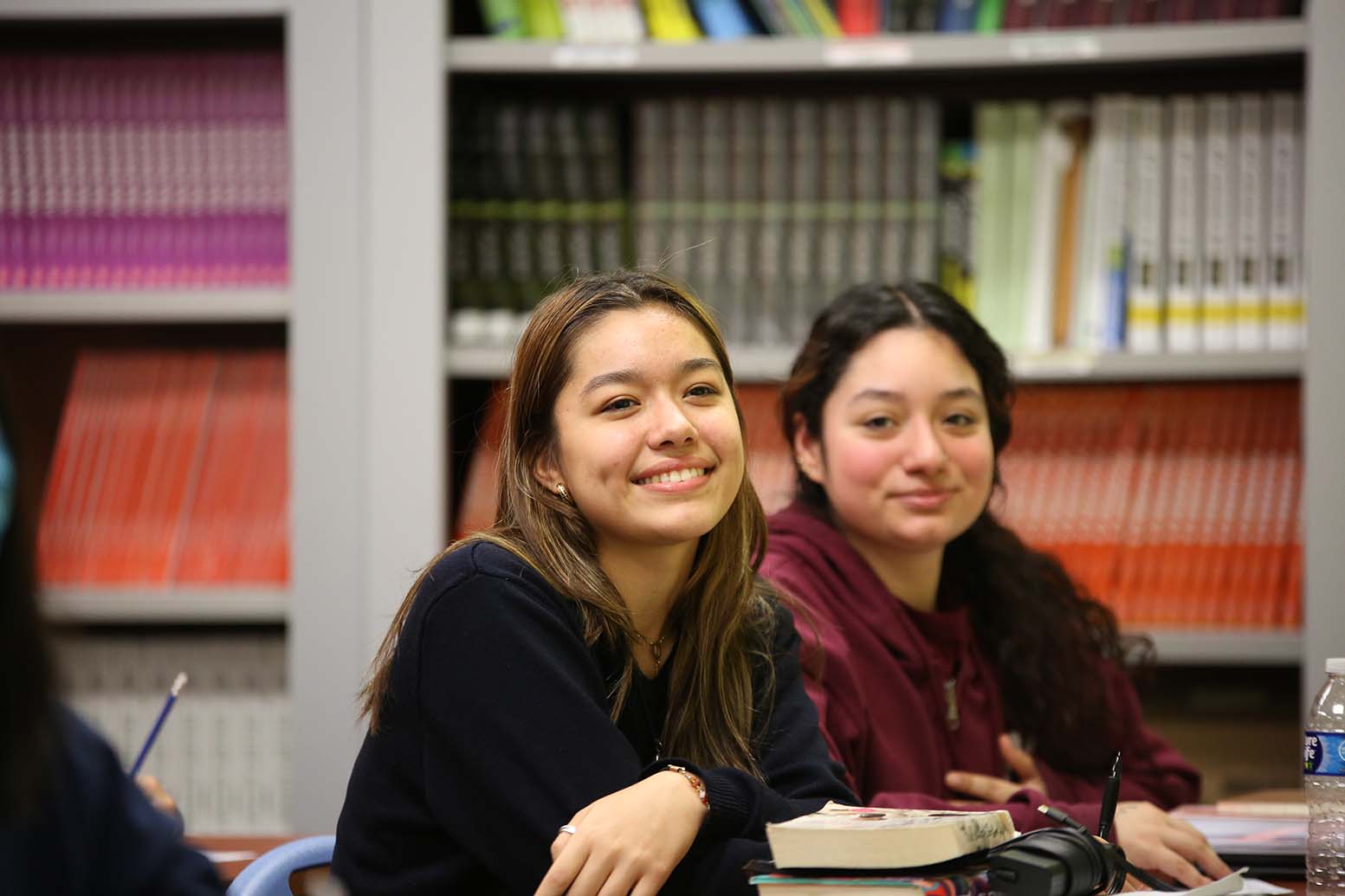 Teacher or school staff member warmly interacting with a student outside